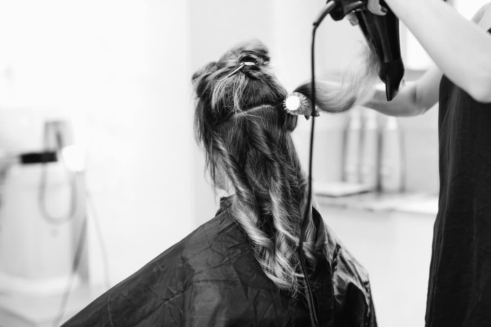 hair being sectioned and blow-dry