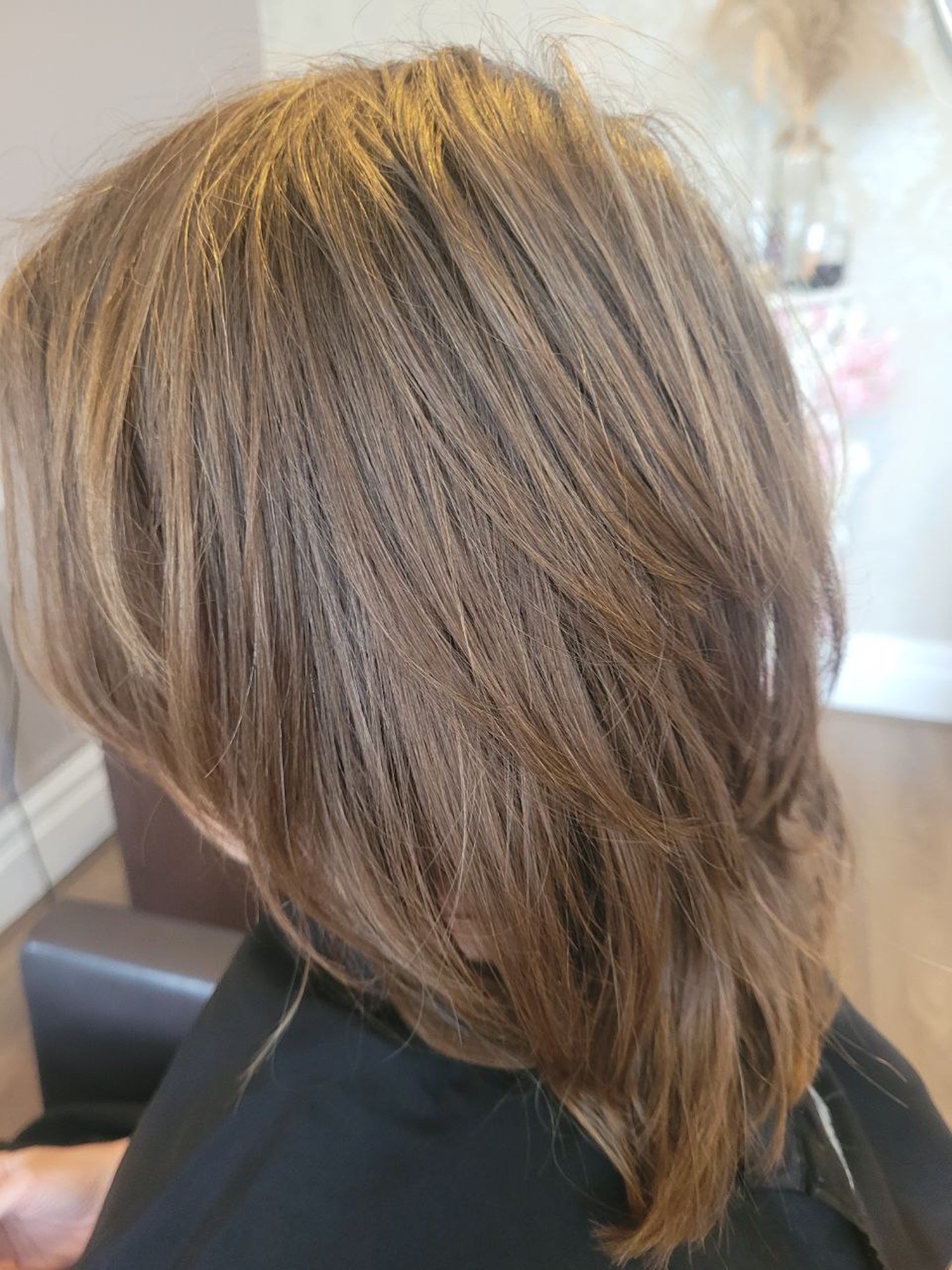 mid length bronde straight hair needing a cut