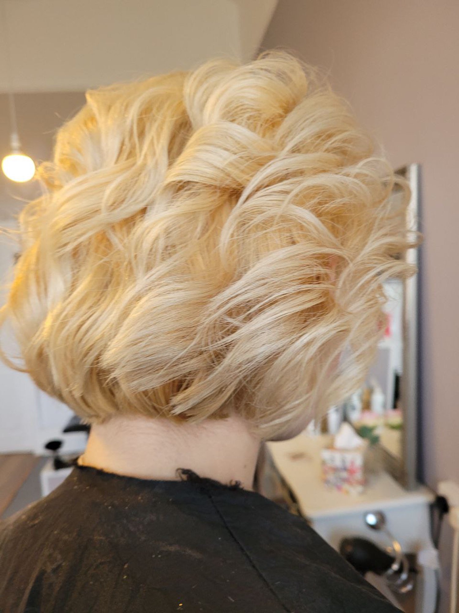 short bobbed blonde hair freshly colored and styled